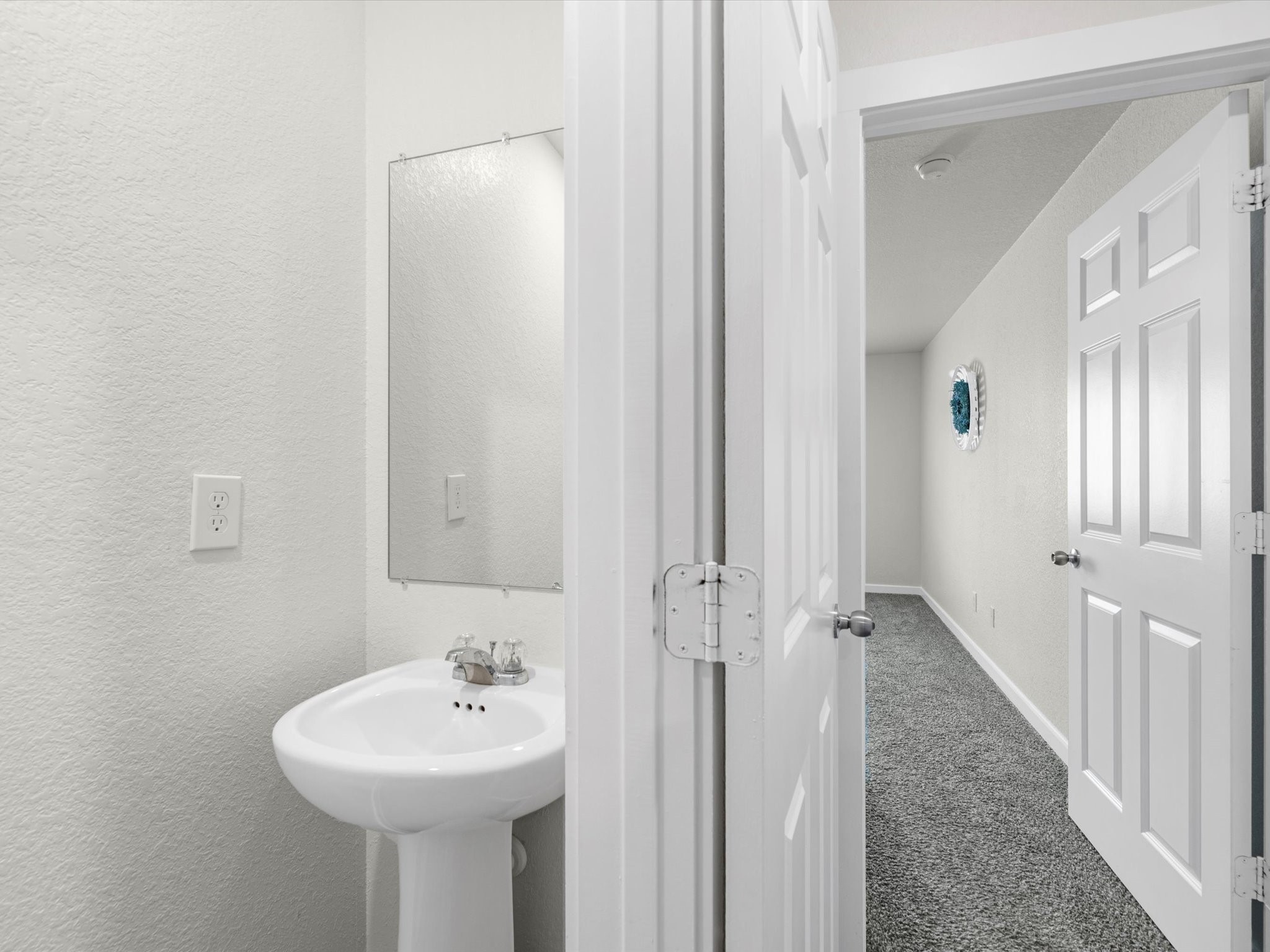 12603 Telge Road, Unit 21E Cypress, TX 77429 - Photo 9 of 32 a bathroom with a sink a mirror and a shower