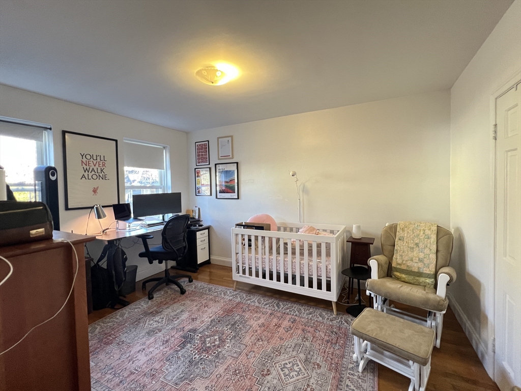 395 Broadway, Unit R2C Cambridge, MA 02139 - Photo 13 of 26 a room with furniture