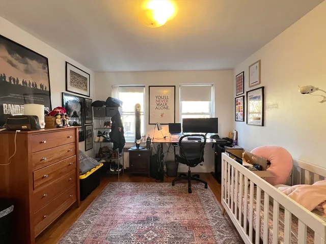 a bedroom with furniture and a window