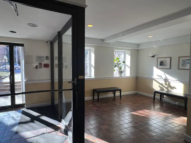 a view of a livingroom with furniture and a window