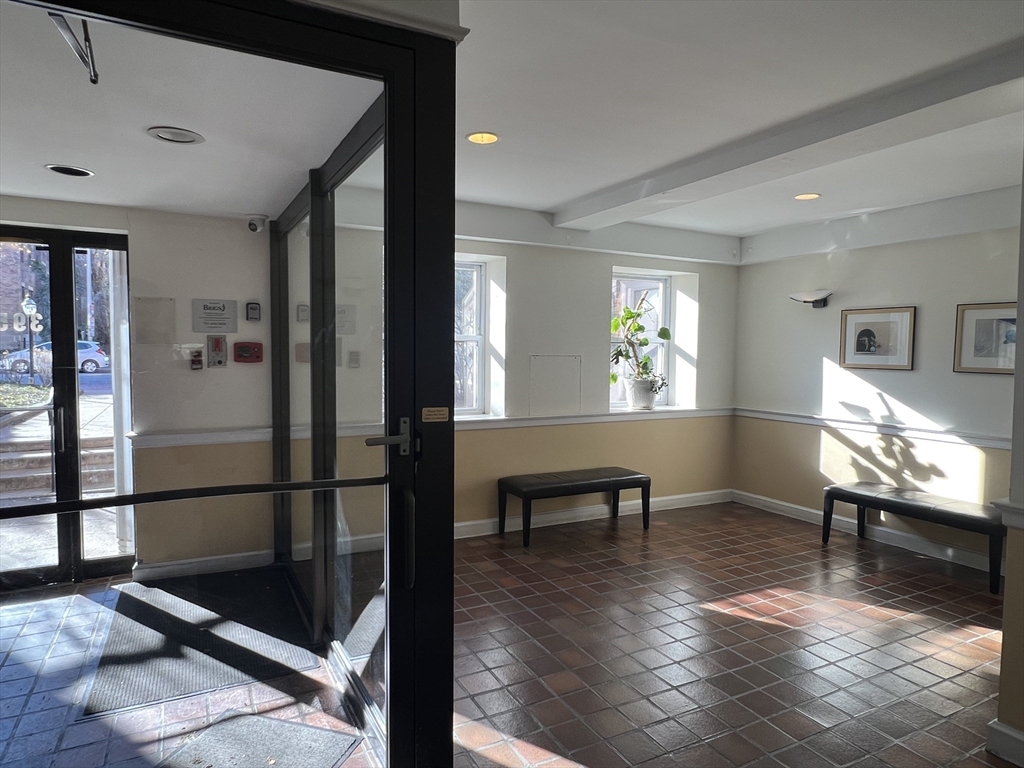 395 Broadway, Unit R2C Cambridge, MA 02139 - Photo 20 of 26 a view of a livingroom with furniture and a window