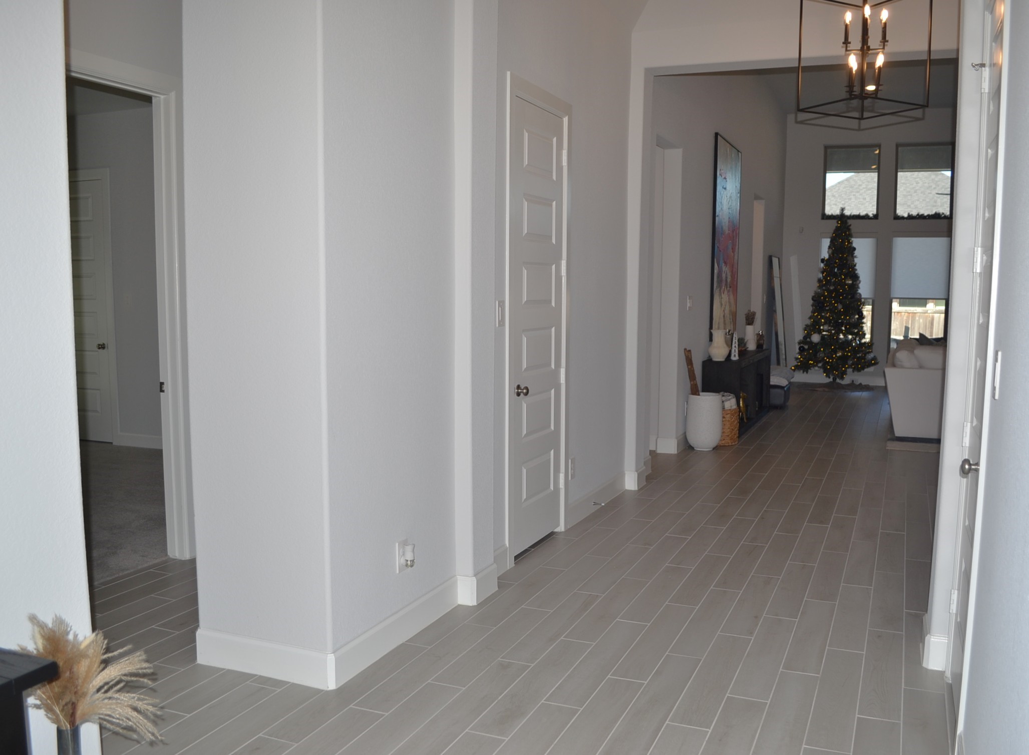 15460 Ringbill Way Magnolia, TX 77354 - Photo 11 of 50 a view of a hallway with bathroom and wooden floor