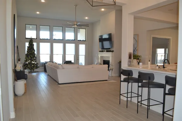 a living room with furniture fireplace and flat screen tv