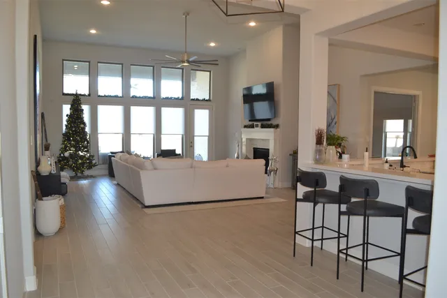 a living room with furniture fireplace and flat screen tv
