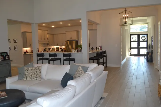 a kitchen with stainless steel appliances kitchen island granite top and refrigerator
