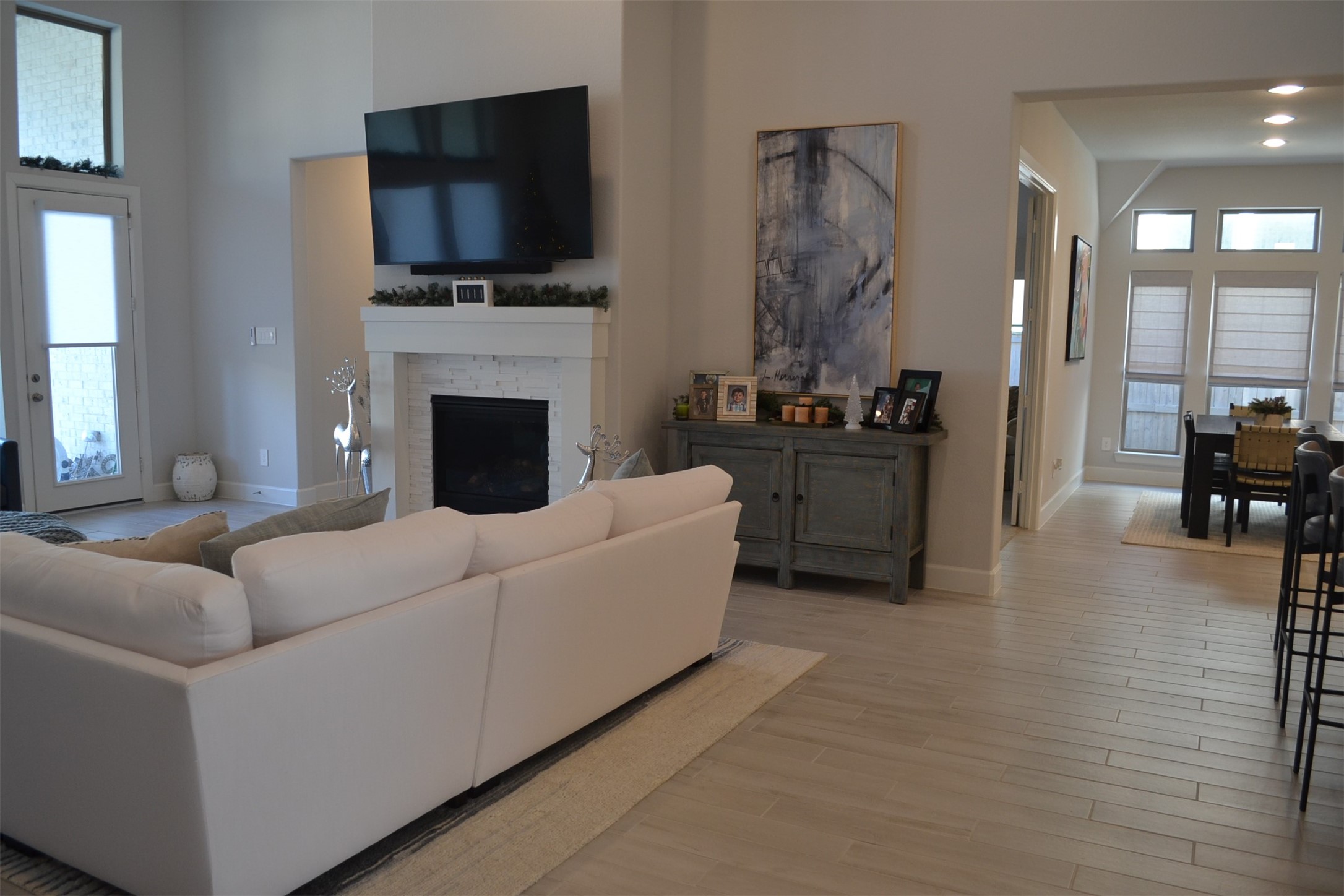 15460 Ringbill Way Magnolia, TX 77354 - Photo 17 of 50 a living room with furniture a flat screen tv and a fireplace