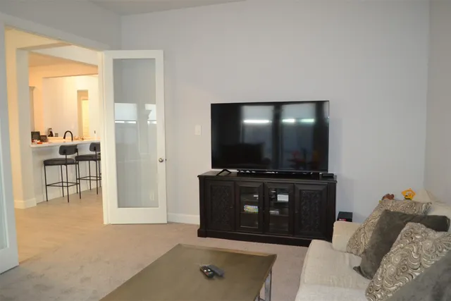 a kitchen with kitchen island granite countertop lots of counter top space and dining table