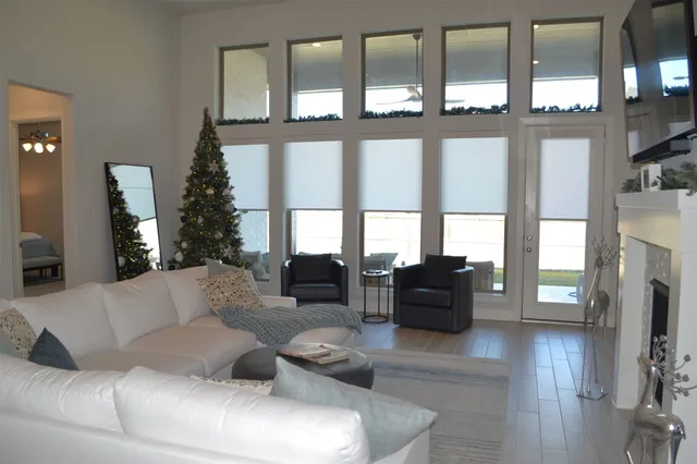 a living room with furniture and painting on the wall