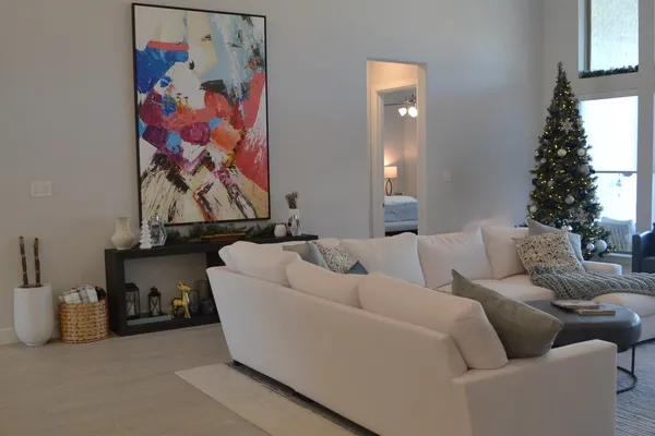 a living room with furniture and a large window