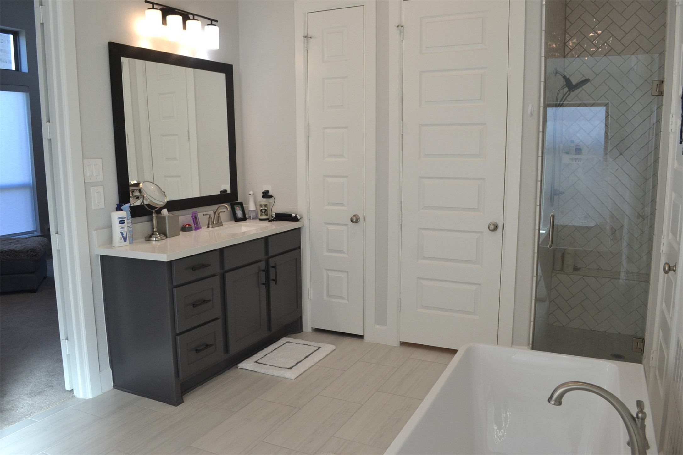 15460 Ringbill Way Magnolia, TX 77354 - Photo 29 of 50 a bathroom with a sink and a mirror