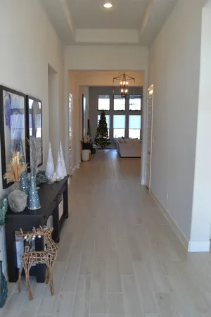 a view of a livingroom with furniture window and wooden floor