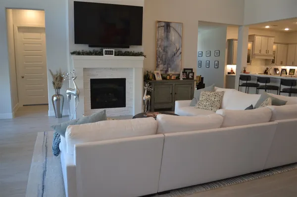 a bedroom with a bed and a tv