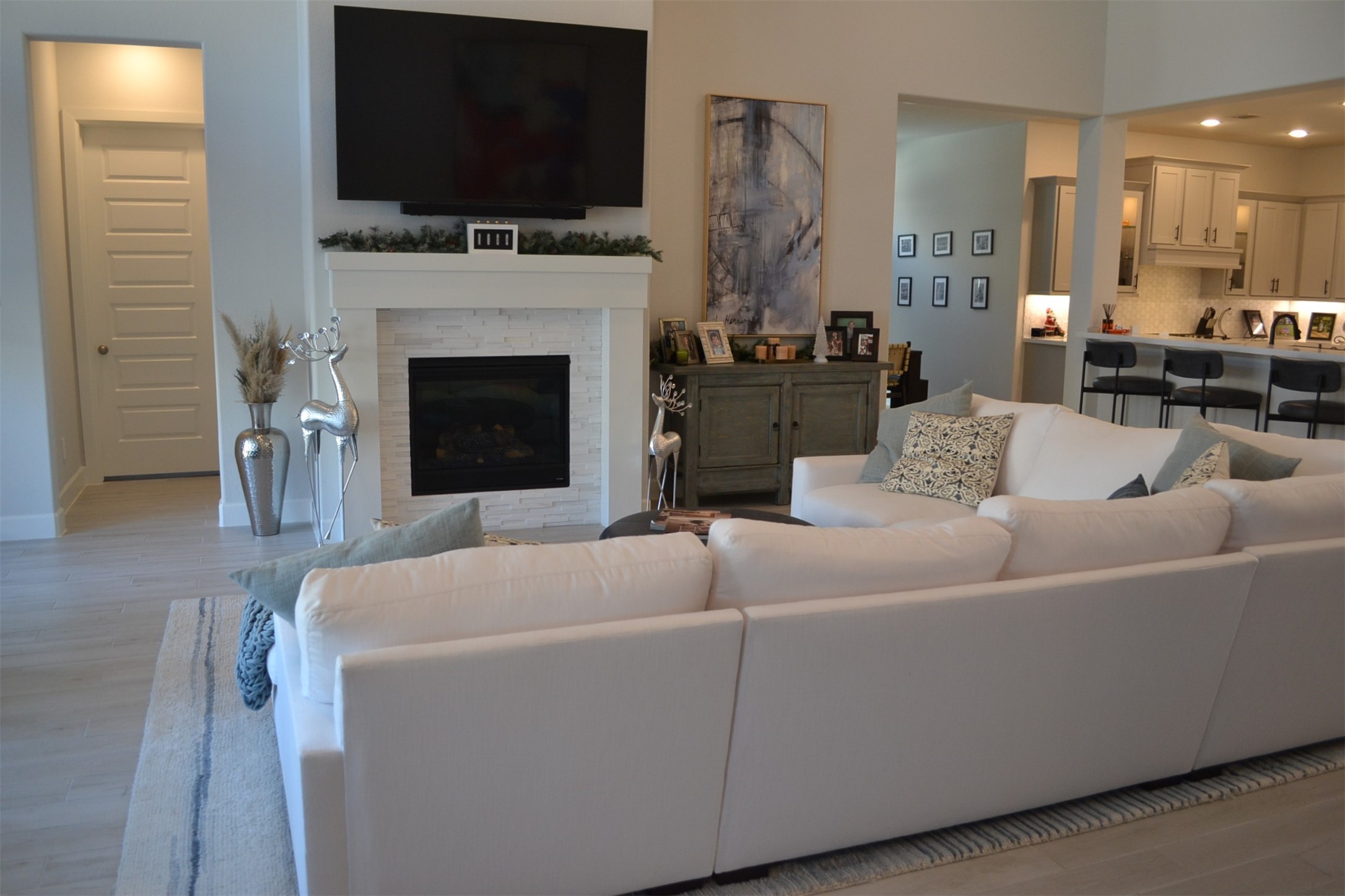 15460 Ringbill Way Magnolia, TX 77354 - Photo 31 of 50 a living room with furniture a flat screen tv and a fireplace