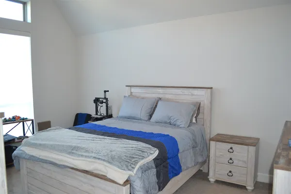 a view of a livingroom with wooden floor cabinet and flat screen tv