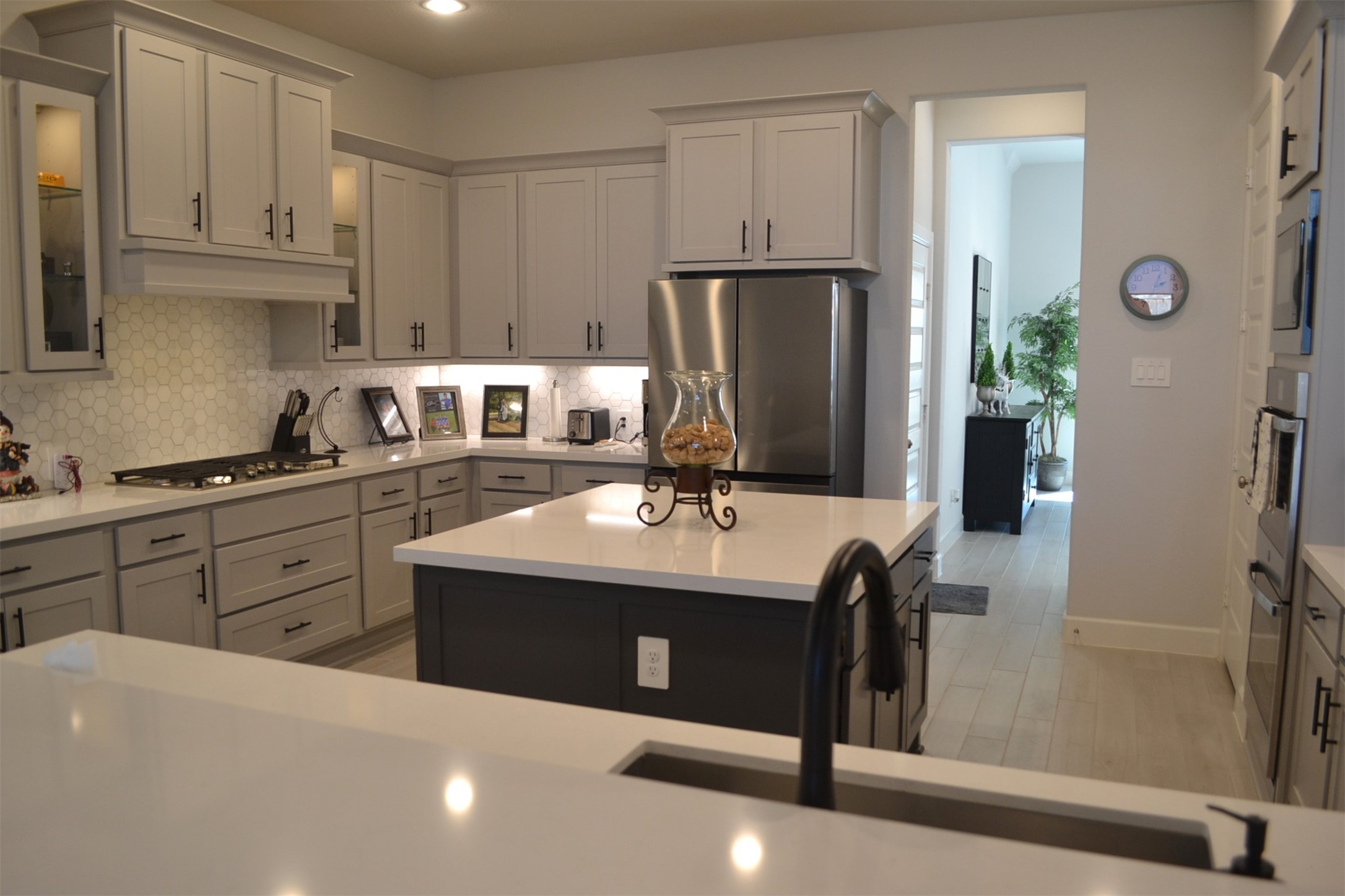 15460 Ringbill Way Magnolia, TX 77354 - Photo 35 of 50 a kitchen with stainless steel appliances a sink cabinets and a refrigerator