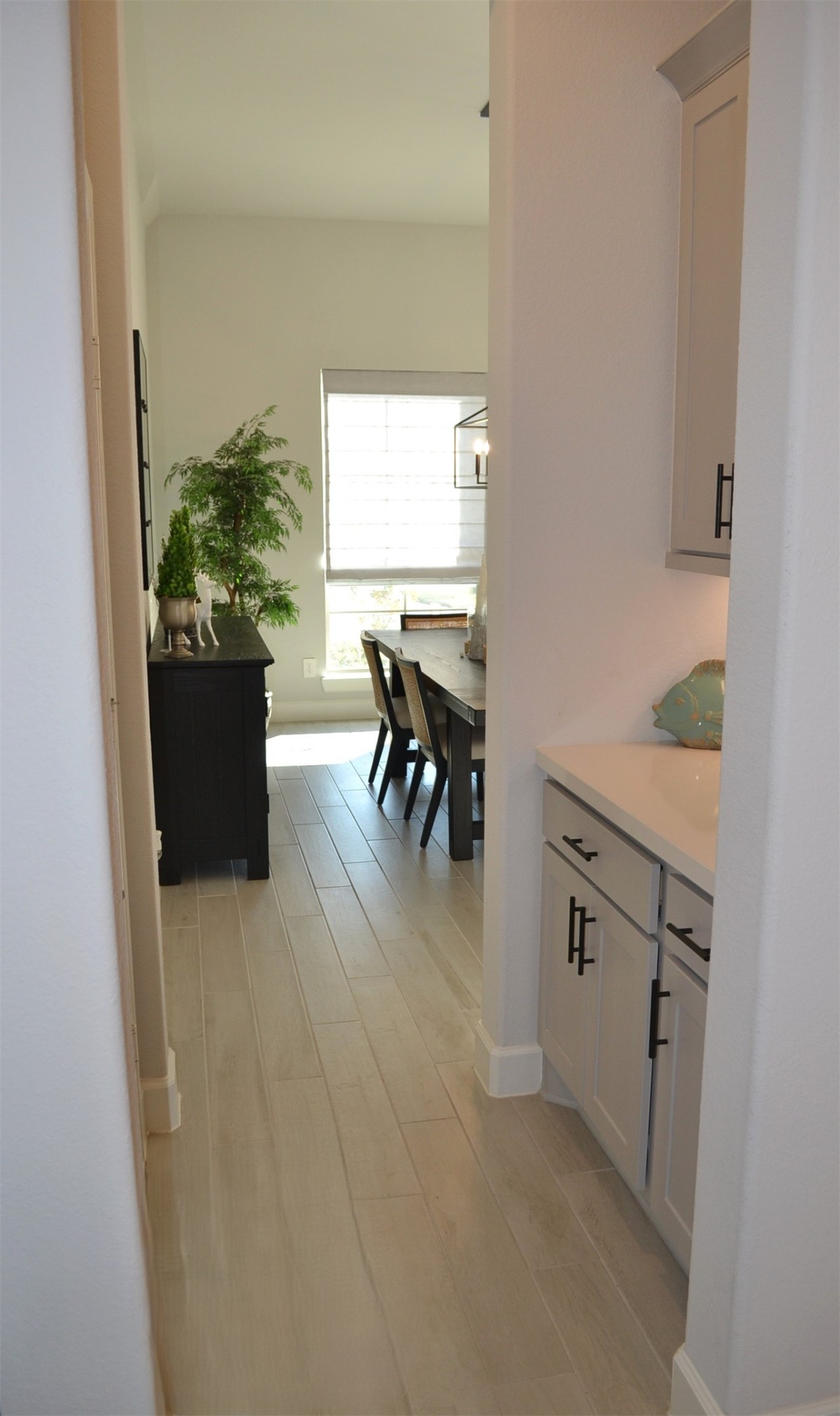 15460 Ringbill Way Magnolia, TX 77354 - Photo 36 of 50 a hallway with a dining table and chairs
