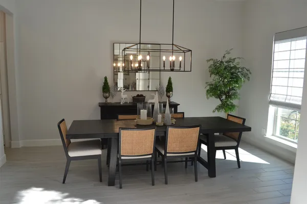 a view of a dining room with furniture and window