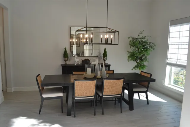 a view of a dining room with furniture and window
