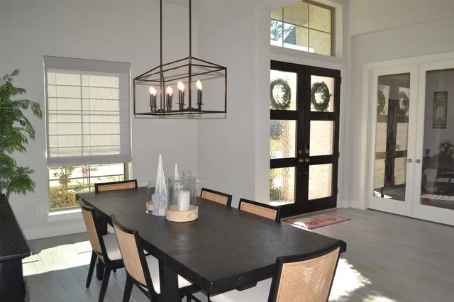 a view of a hallway with a chair and front door