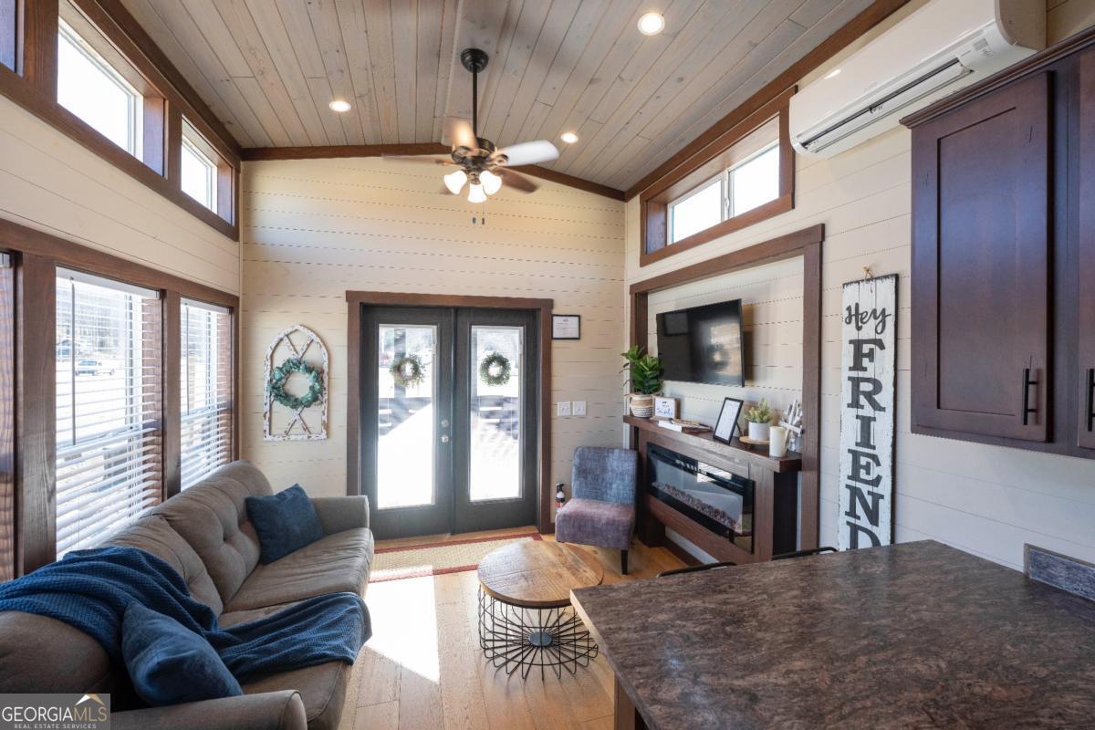 192 Mountain Road Morganton, GA 30560 - Photo 11 of 42 a living room with furniture and a large window
