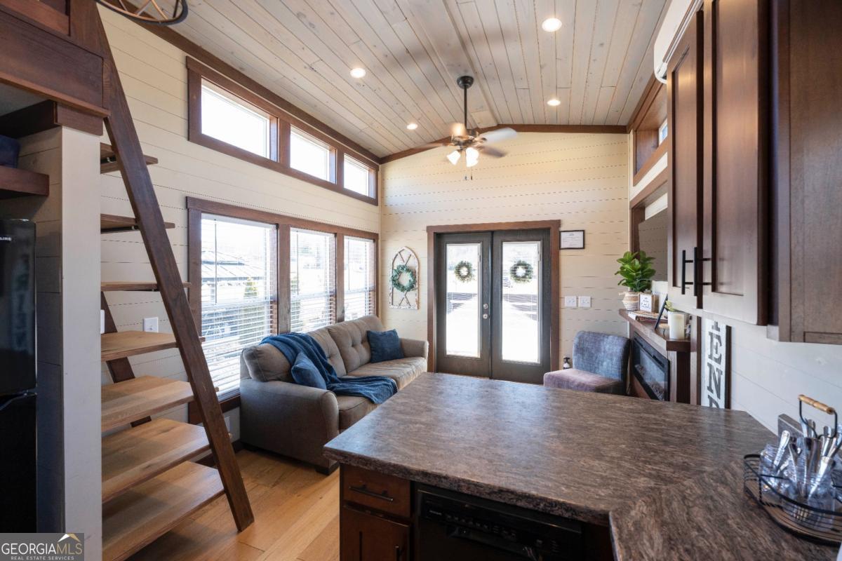 192 Mountain Road Morganton, GA 30560 - Photo 12 of 42 a living room with furniture and a large window