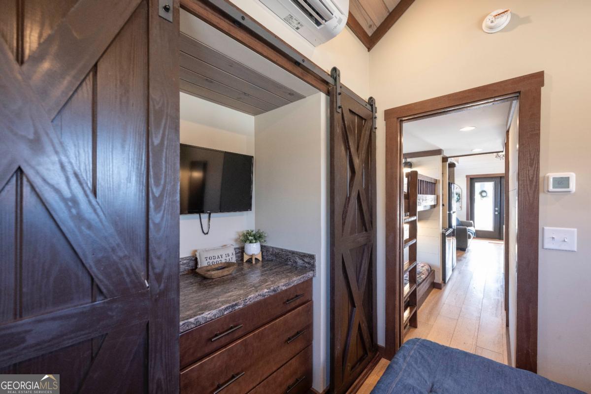 192 Mountain Road Morganton, GA 30560 - Photo 15 of 42 a en suite bathroom with a granite countertop sink and mirror