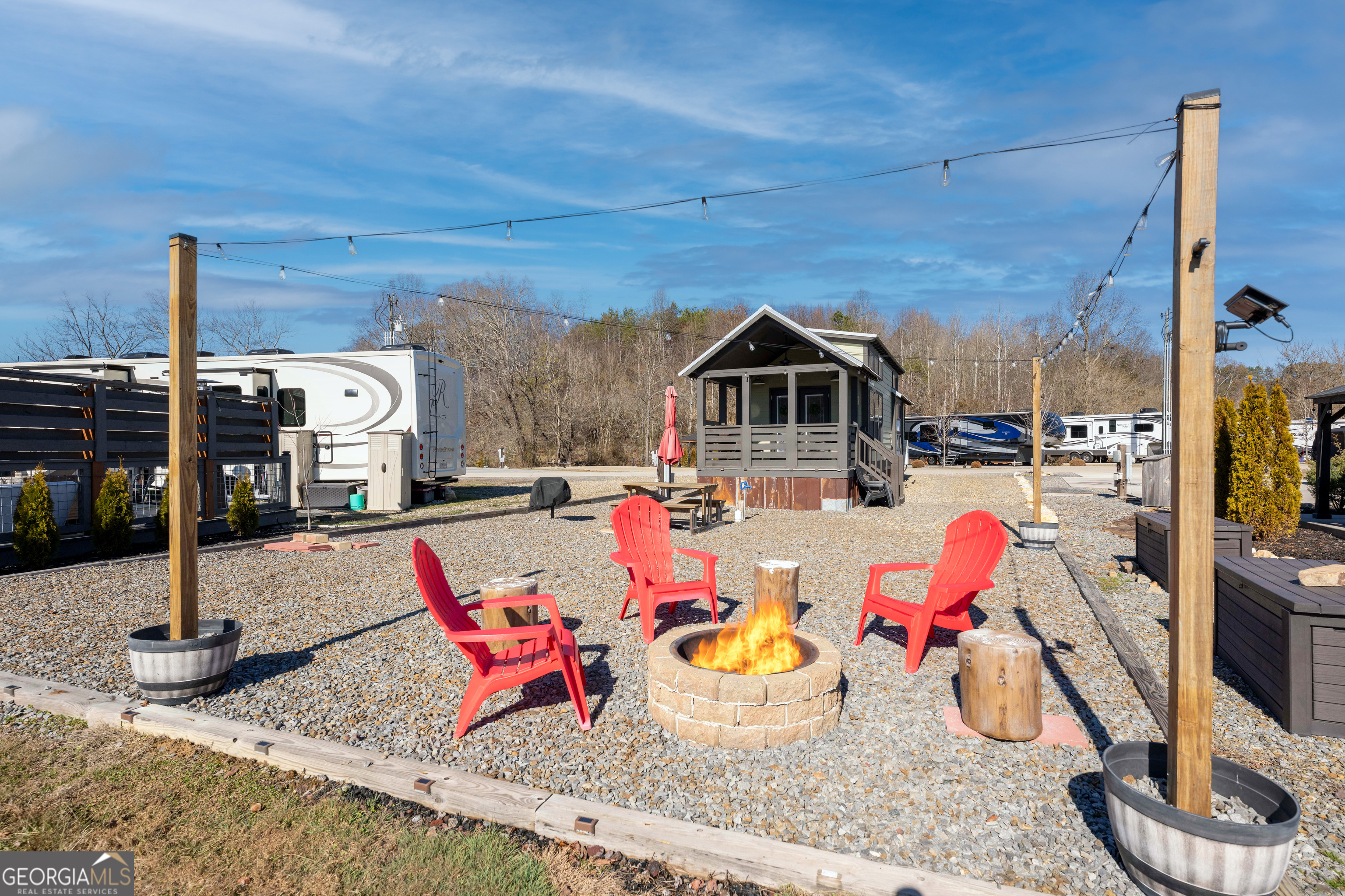 192 Mountain Road Morganton, GA 30560 - Photo 25 of 42 a view of a chairs and tables in patio