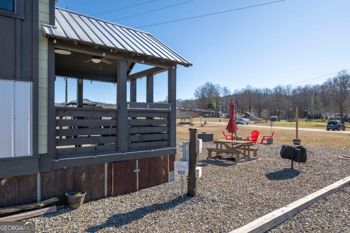 192 Mountain Road Morganton, GA 30560 - Photo 26 of 42 a view of a two chairs and table in the patio