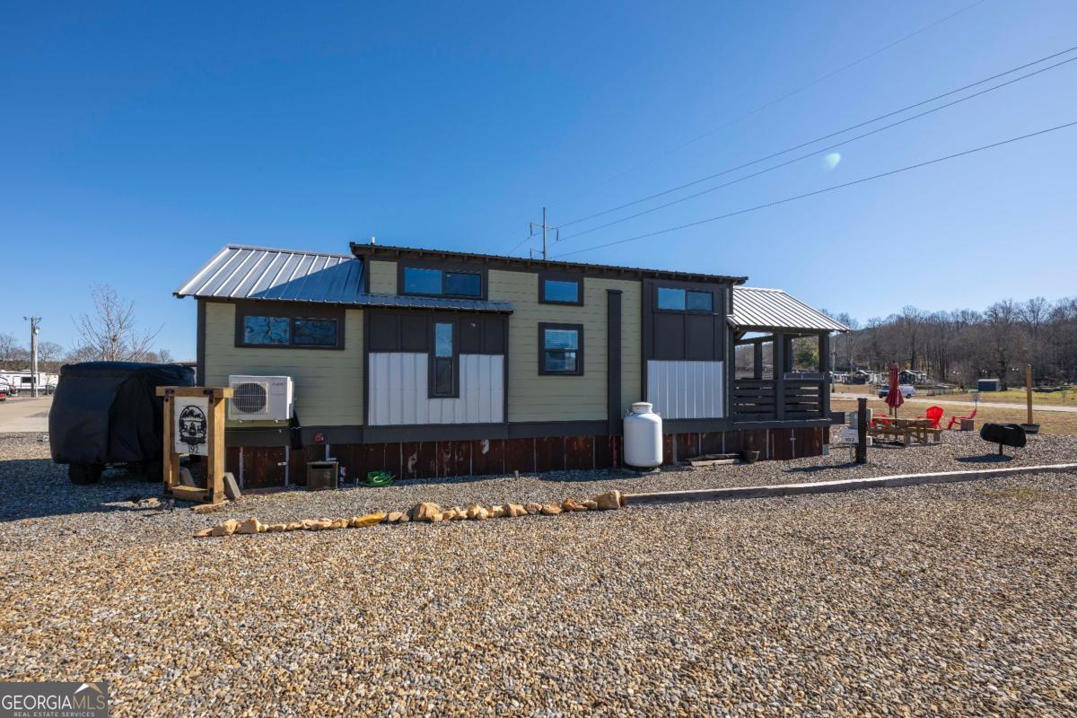 192 Mountain Road Morganton, GA 30560 - Photo 28 of 42 a front view of a house with a yard