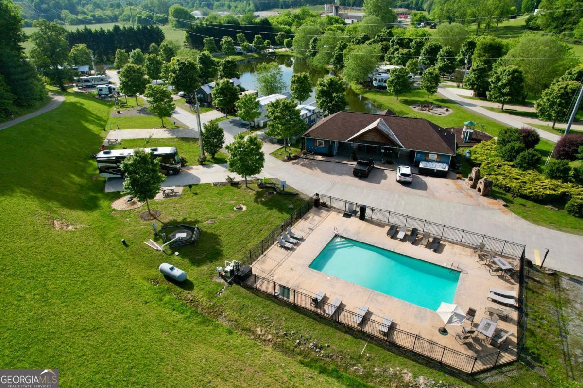 192 Mountain Road Morganton, GA 30560 - Photo 33 of 42 an aerial view of a house with a garden and swimming pool