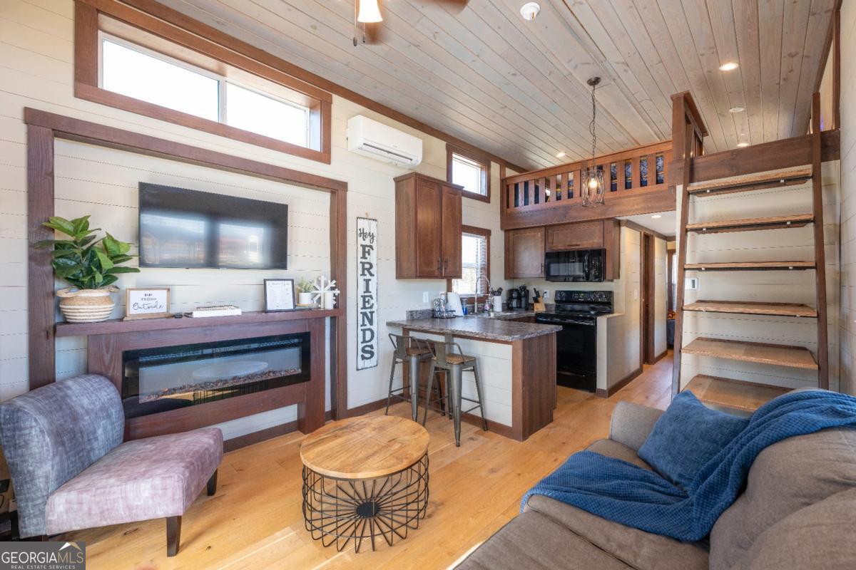 192 Mountain Road Morganton, GA 30560 - Photo 6 of 42 a living room with furniture and a flat screen tv