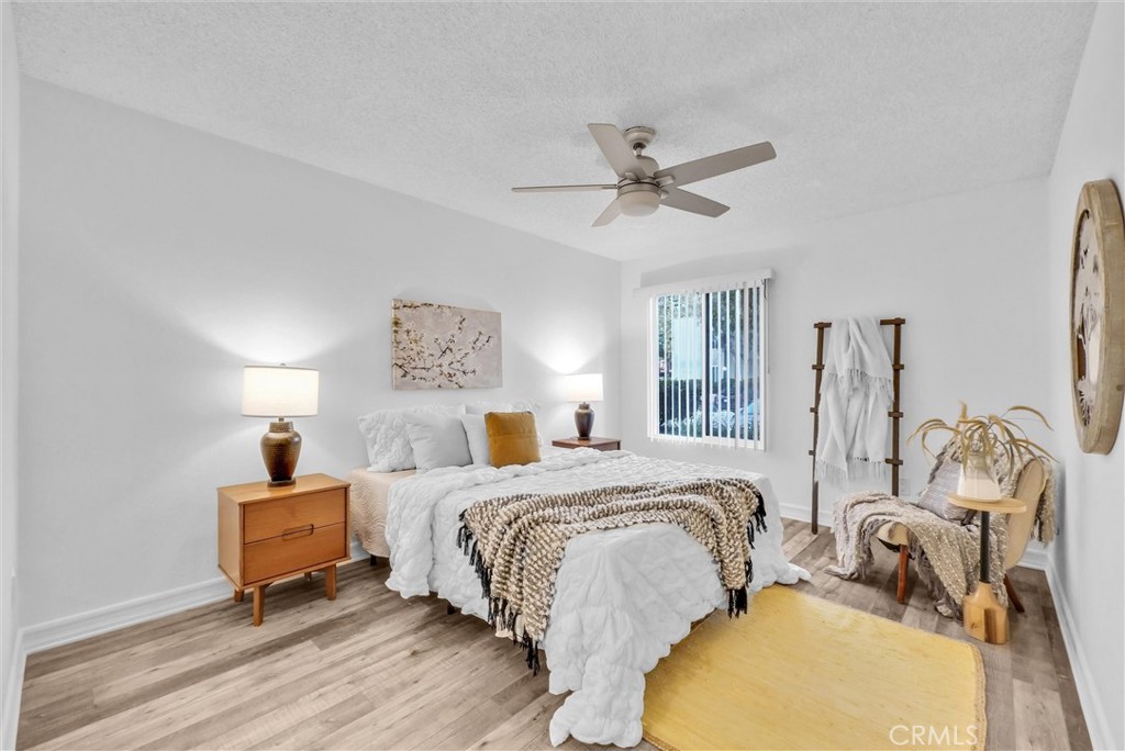 1030 West MacArthur Boulevard, Unit 5 Santa Ana, CA 92707 - Photo 14 of 26 a bedroom with bed and a window