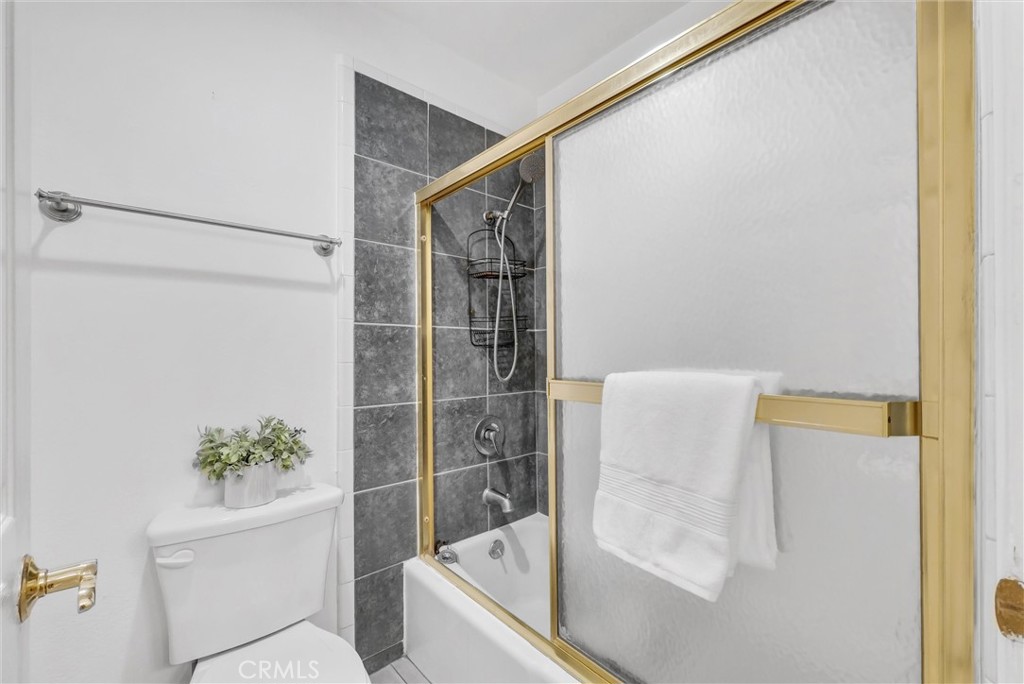 1030 West MacArthur Boulevard, Unit 5 Santa Ana, CA 92707 - Photo 20 of 26 a bathroom with a shower and a toilet