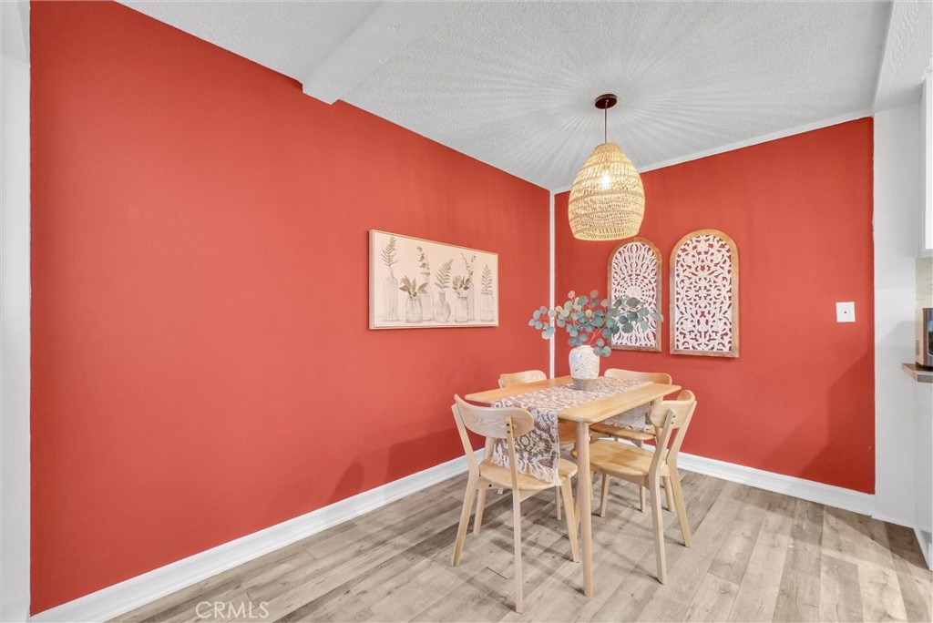 1030 West MacArthur Boulevard, Unit 5 Santa Ana, CA 92707 - Photo 6 of 26 a dining room with furniture and window