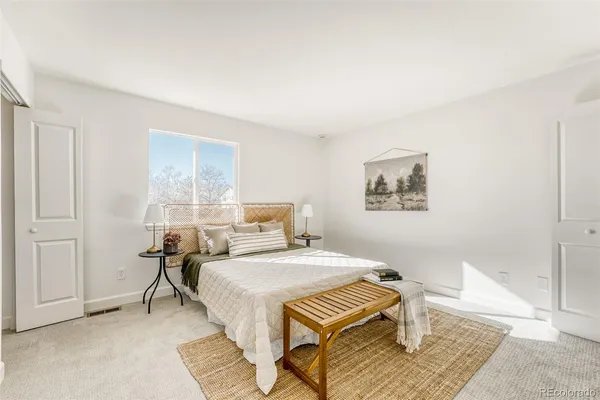 a bedroom with a bed and a table in it
