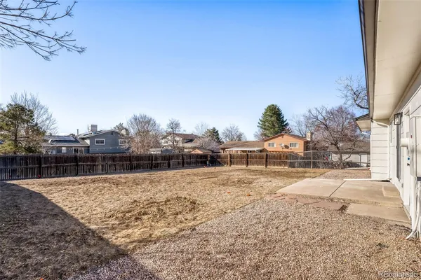 a backyard of a house with wooden fence