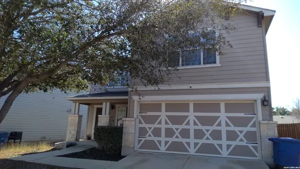 a front view of a house with a garage