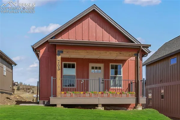a view of front of house with a yard