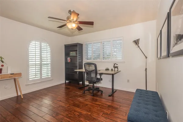 a work room with furniture and wooden floor