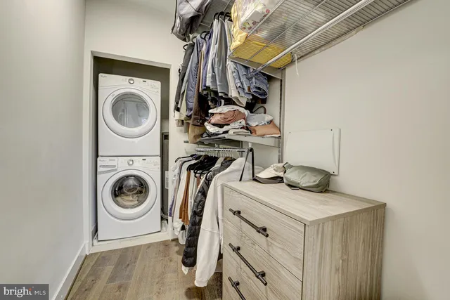 a utility room with sink dryer and washer