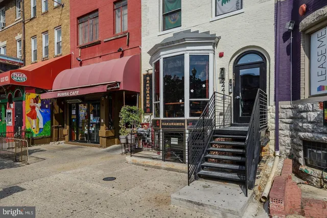 a view of a building with sitting area