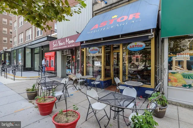 a view of a cafe with a table and chairs