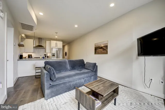a living room with a couch and a flat screen tv