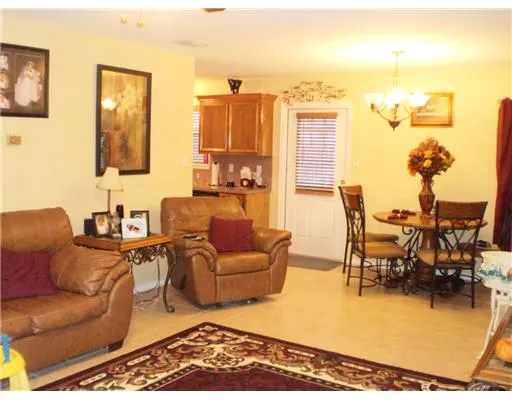 a living room with furniture wooden floor and a table