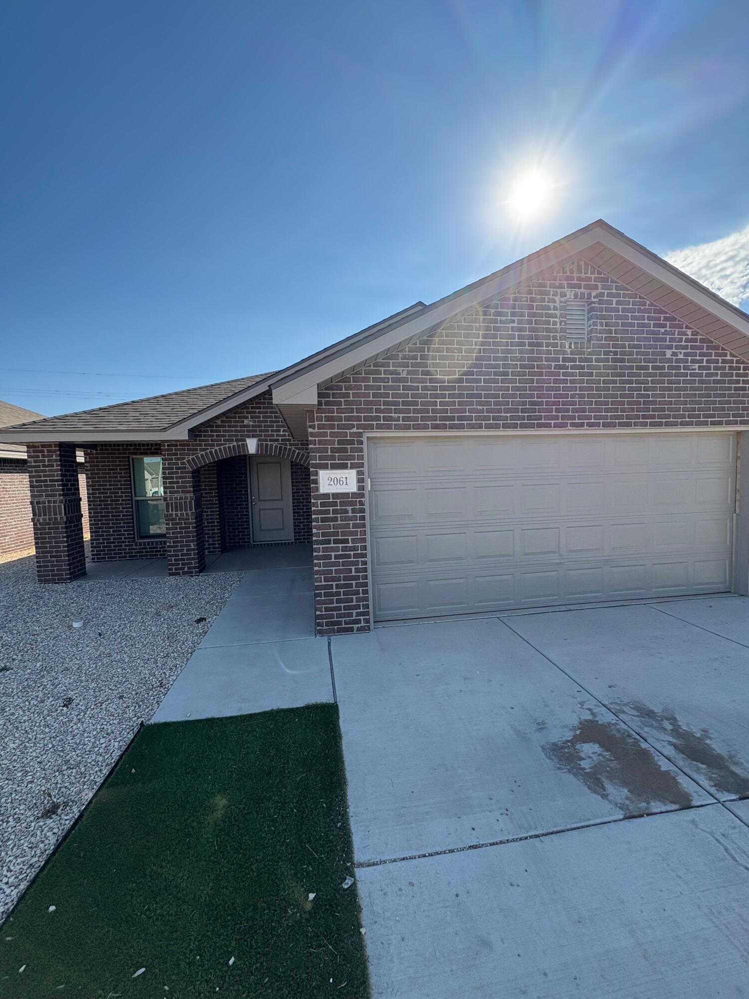 2061 Kenwood Avenue Lubbock, TX 79407 - Photo 1 of 6 a view of an empty room with a fireplace