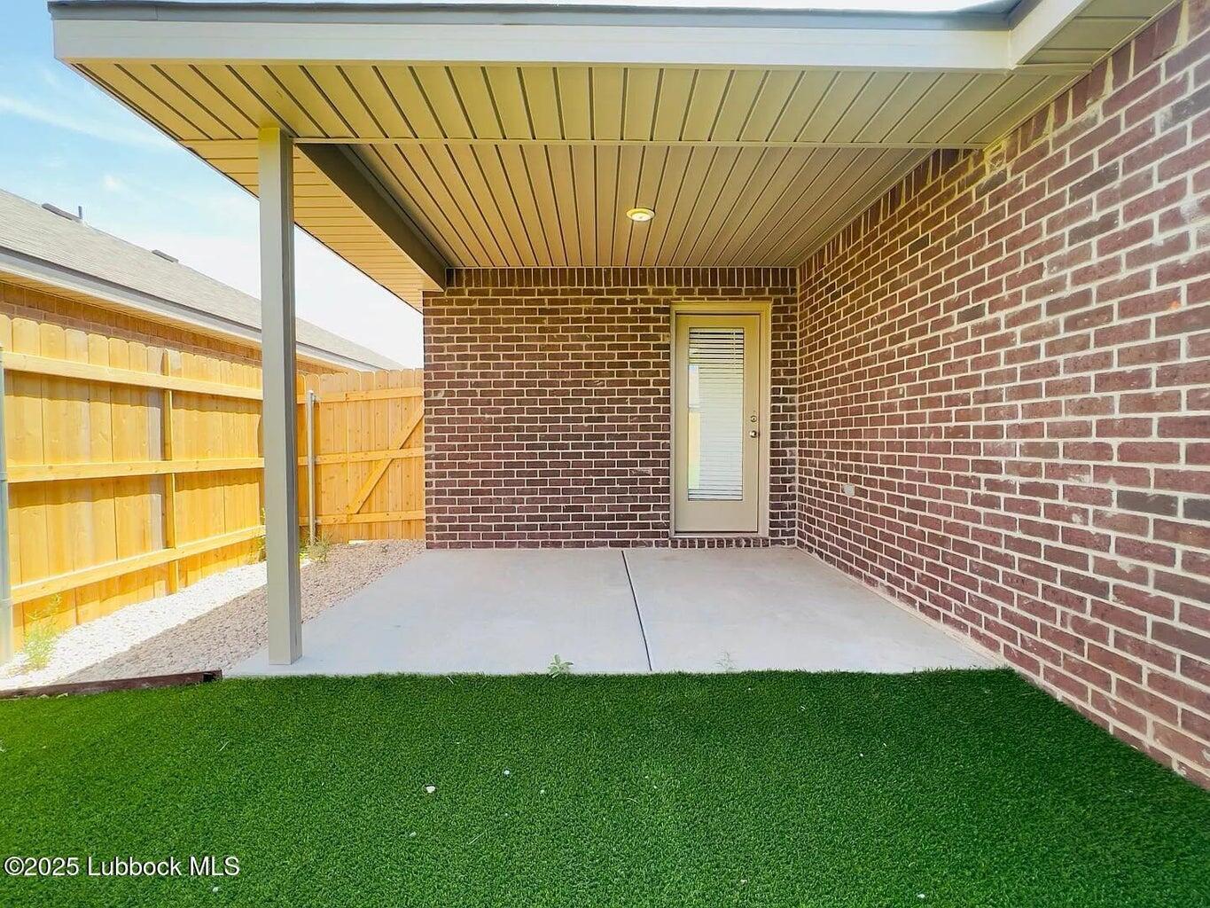2061 Kenwood Avenue Lubbock, TX 79407 - Photo 6 of 6 a view of an empty room with a window