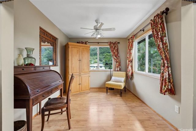 a bed room with a bed and a chandelier