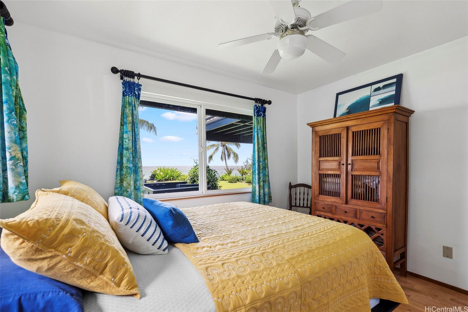 59-535 Ke Iki Road, Unit A Haleiwa, HI 96712 - Photo 17 of 25 a bedroom with a bed and a large window
