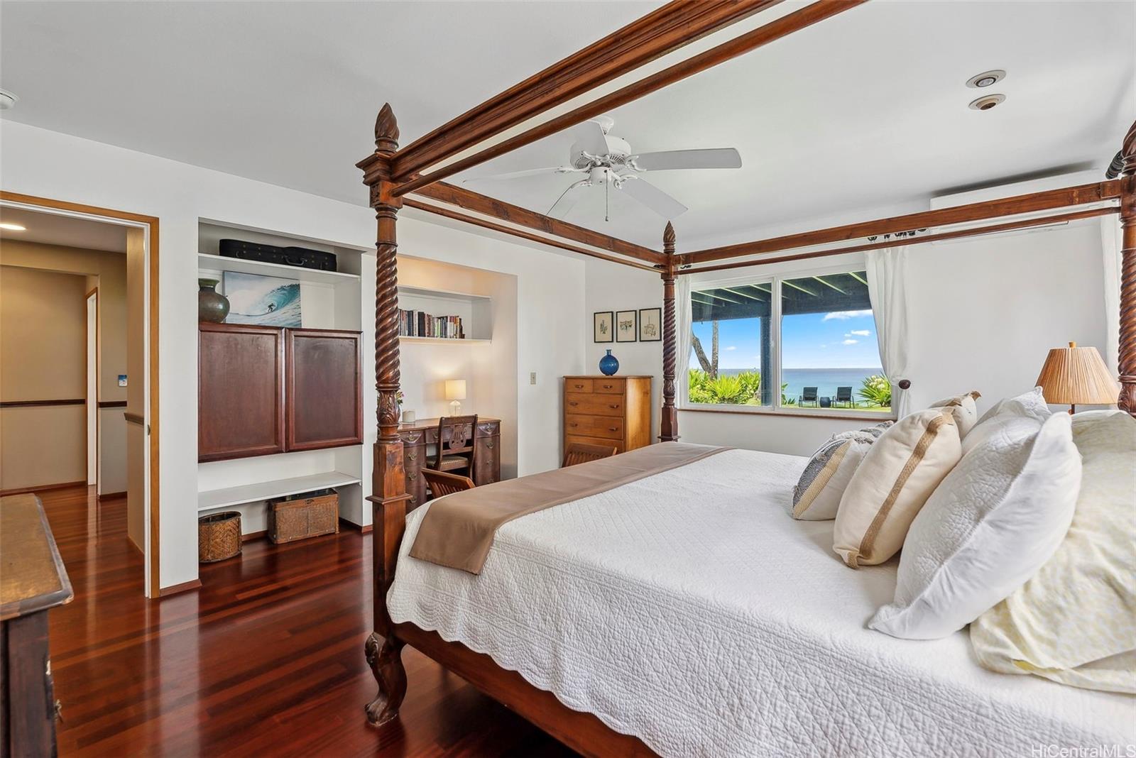 59-535 Ke Iki Road, Unit A Haleiwa, HI 96712 - Photo 18 of 25 a bedroom with a bed a dresser and chair