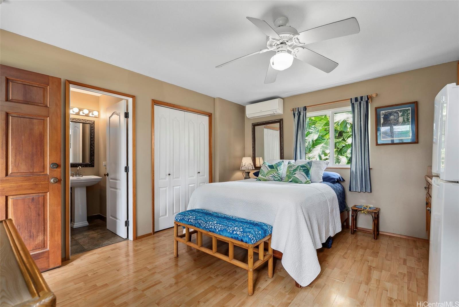 59-535 Ke Iki Road, Unit A Haleiwa, HI 96712 - Photo 20 of 25 a bed sitting in a spacious bedroom next to a window